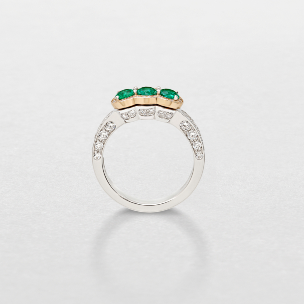 white and pink gold with diamonds and emeralds ring