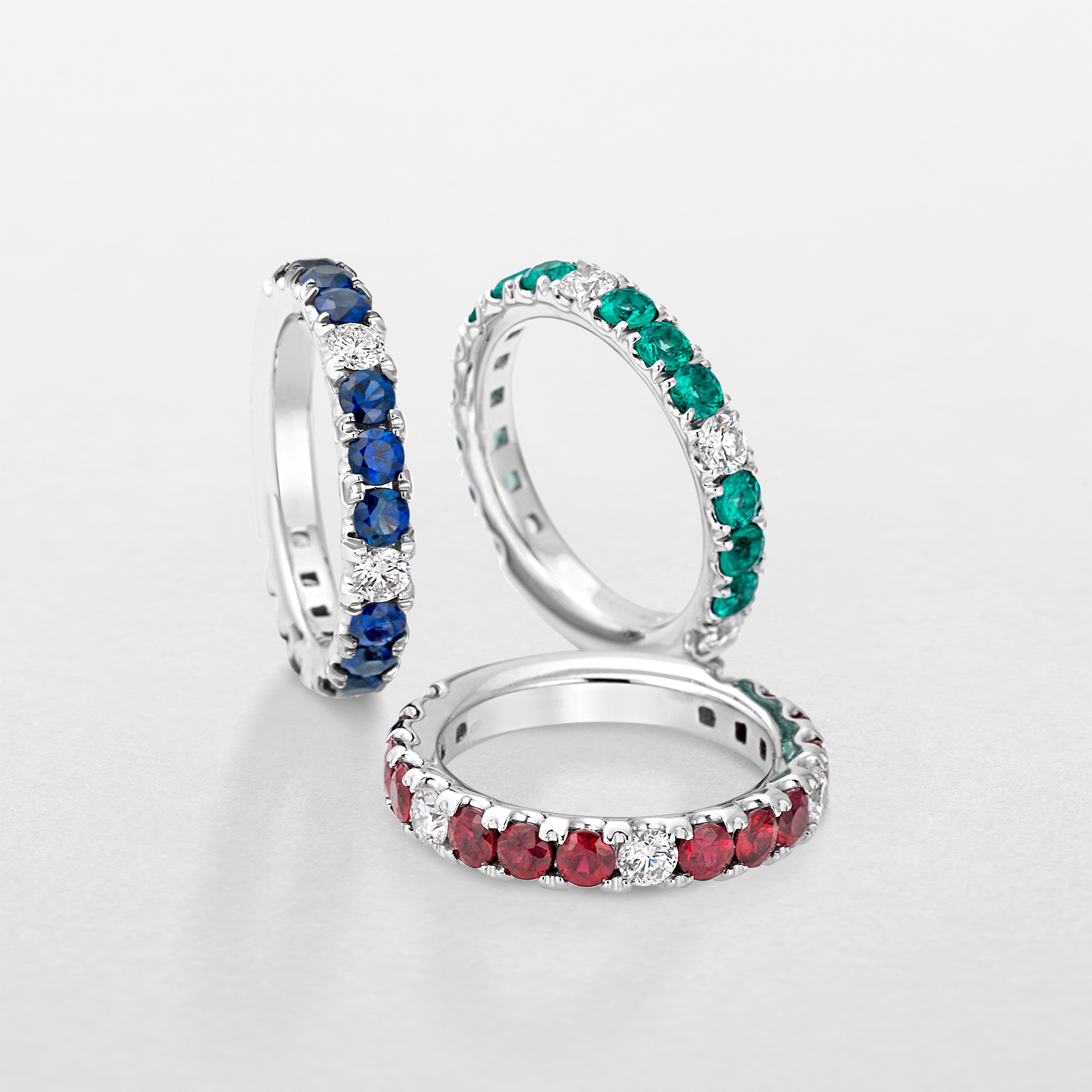 white gold with diamonds and precious color stones ring