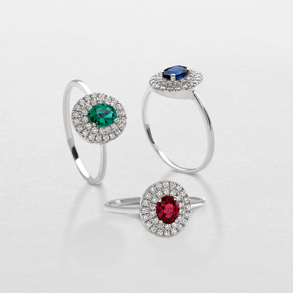 white gold with diamonds and precious color stones ring