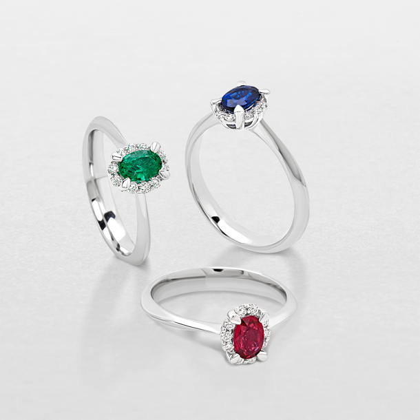 white gold with diamonds and precious color stones ring