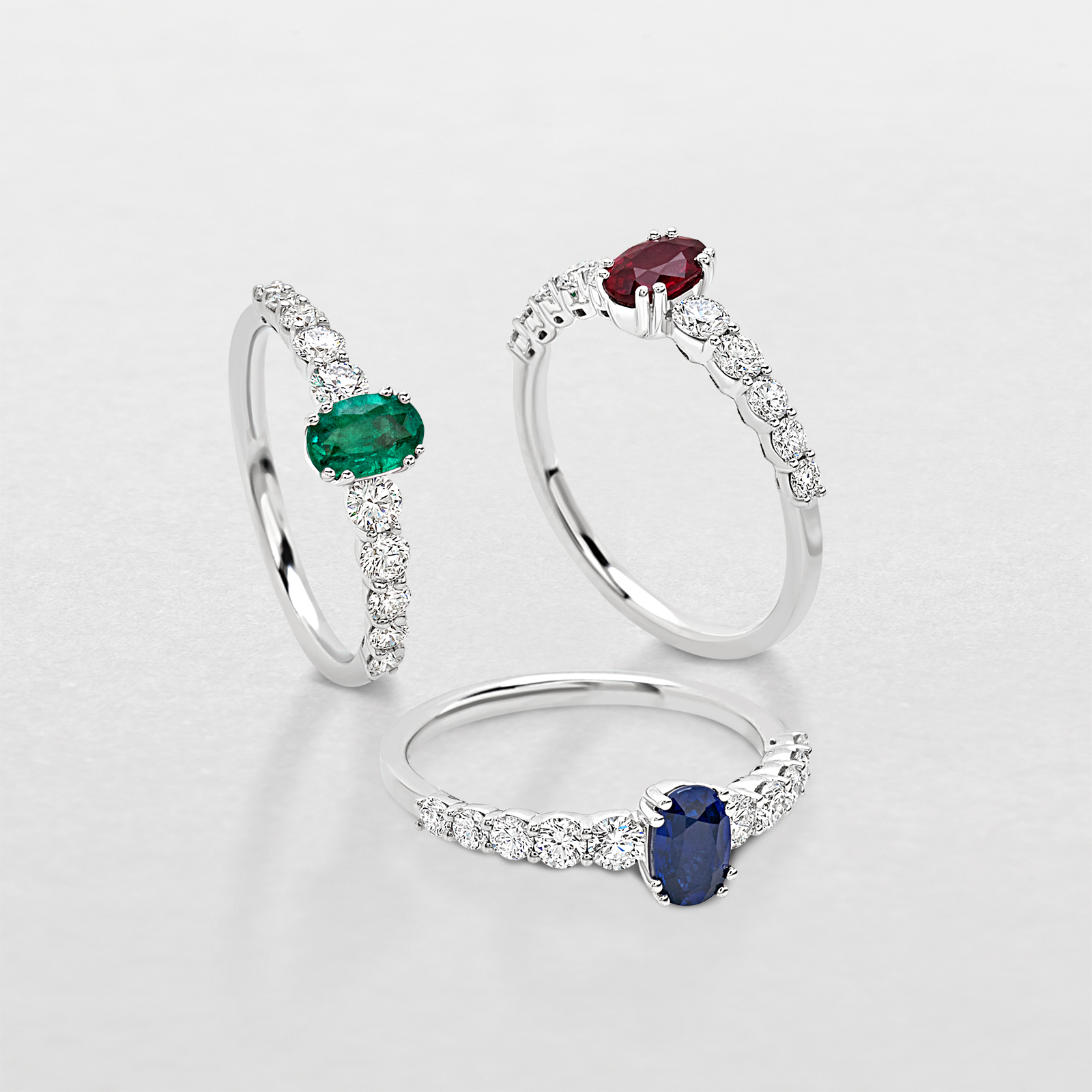white gold with diamonds and precious color stones ring