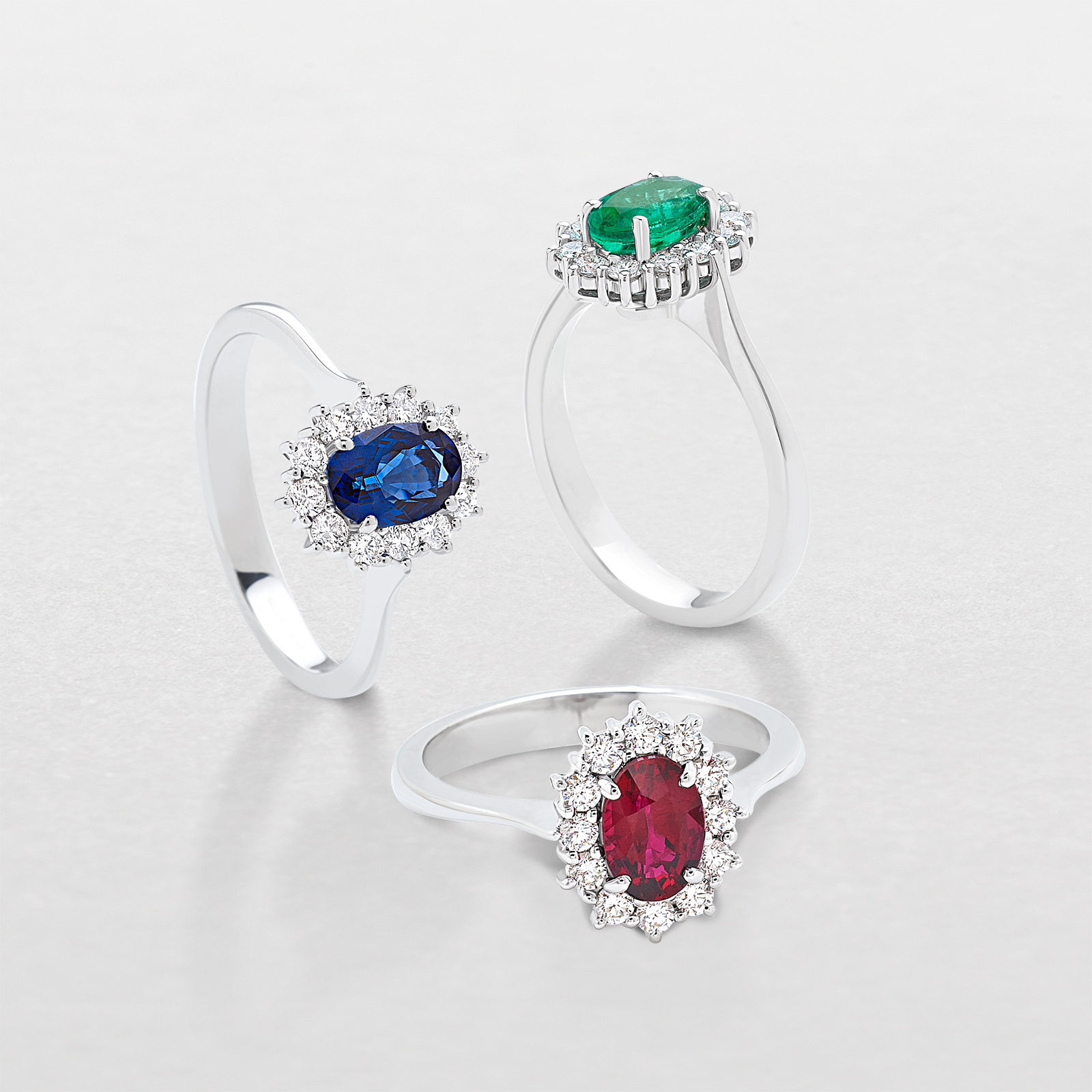 white gold with diamonds and precious color stones ring