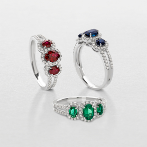 white gold with diamonds and precious color stones ring