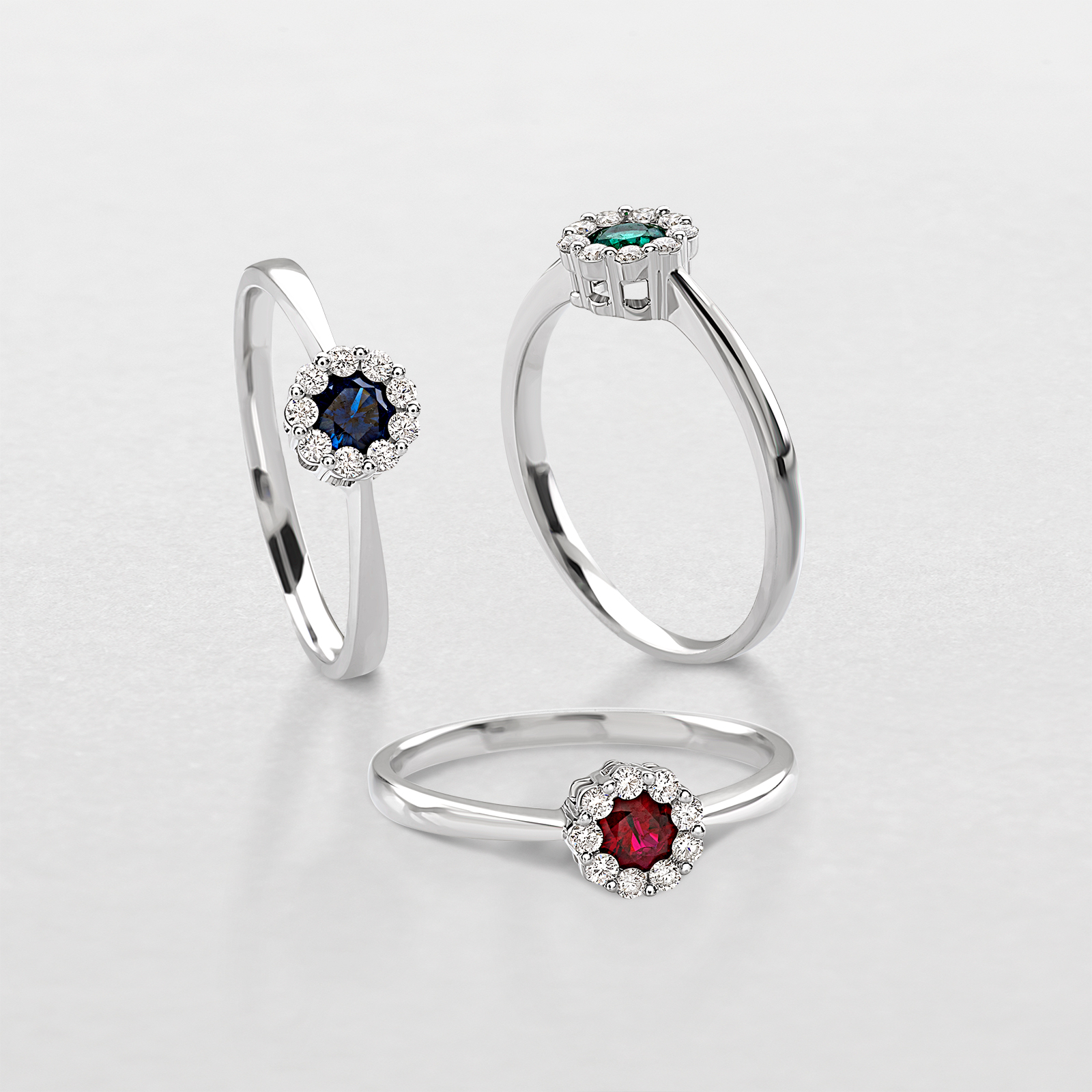 white gold with diamonds and precious color stones ring