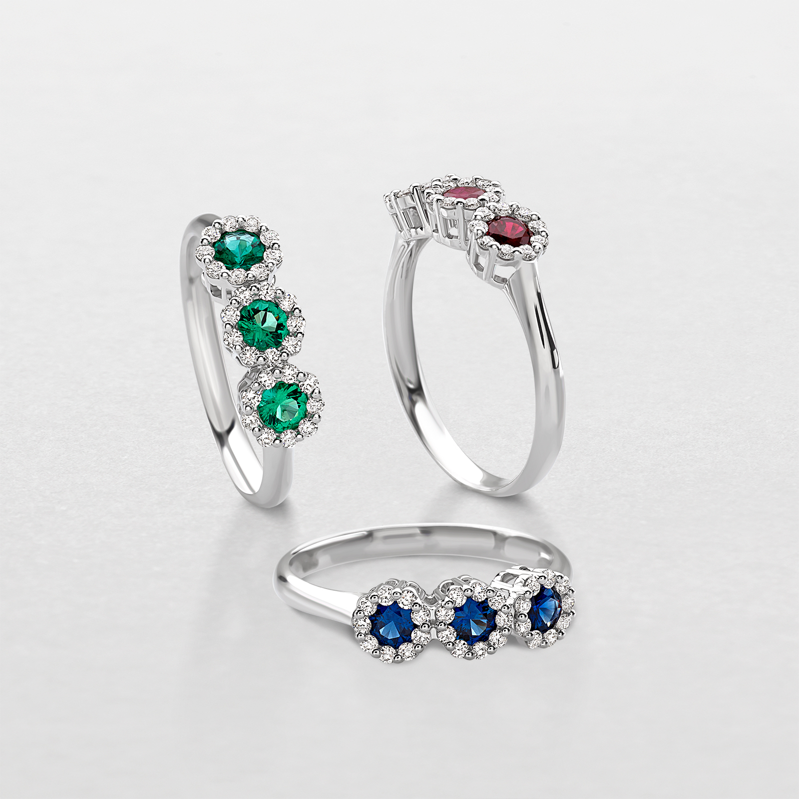 white gold with diamonds and precious color stones ring