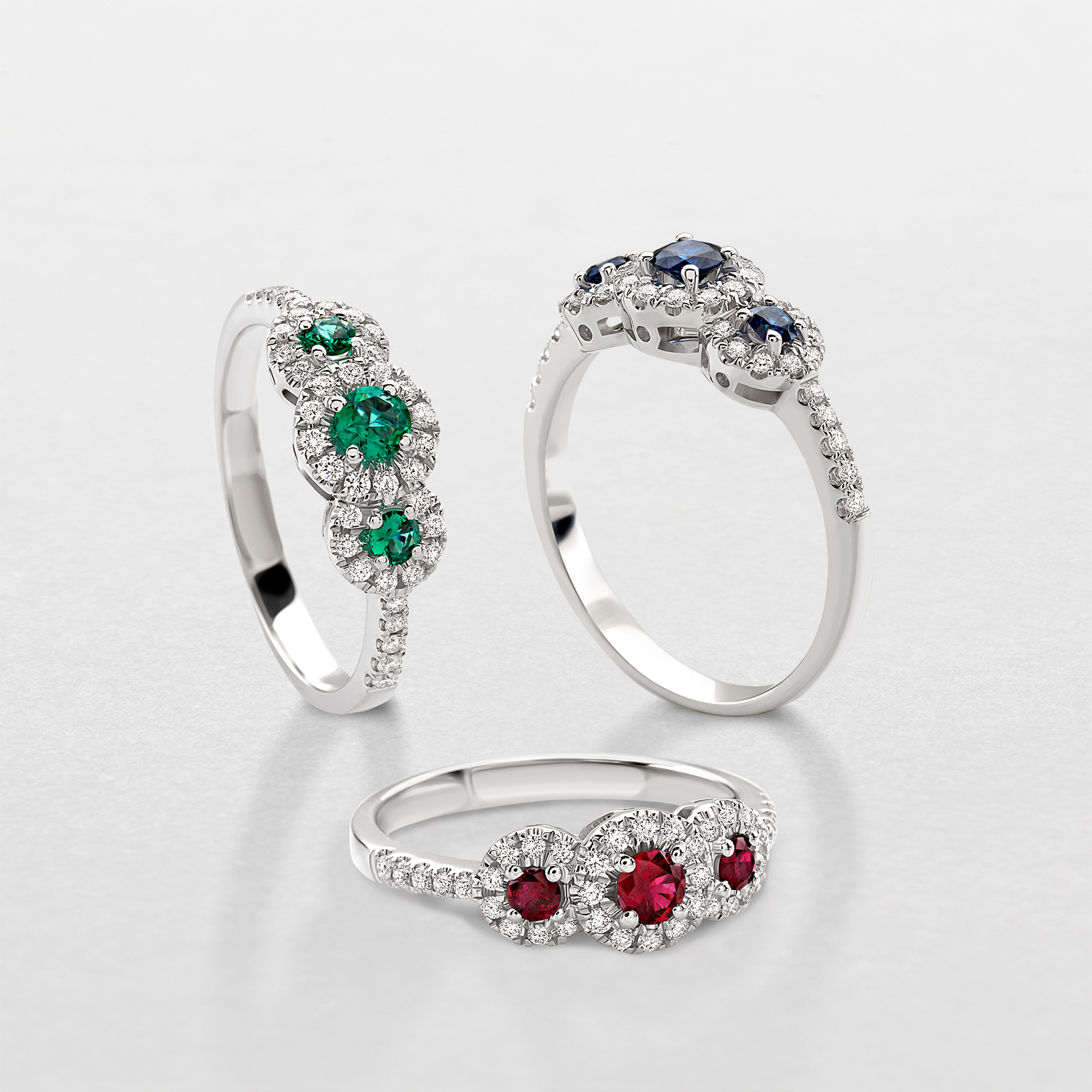 white gold with diamonds and precious color stones ring