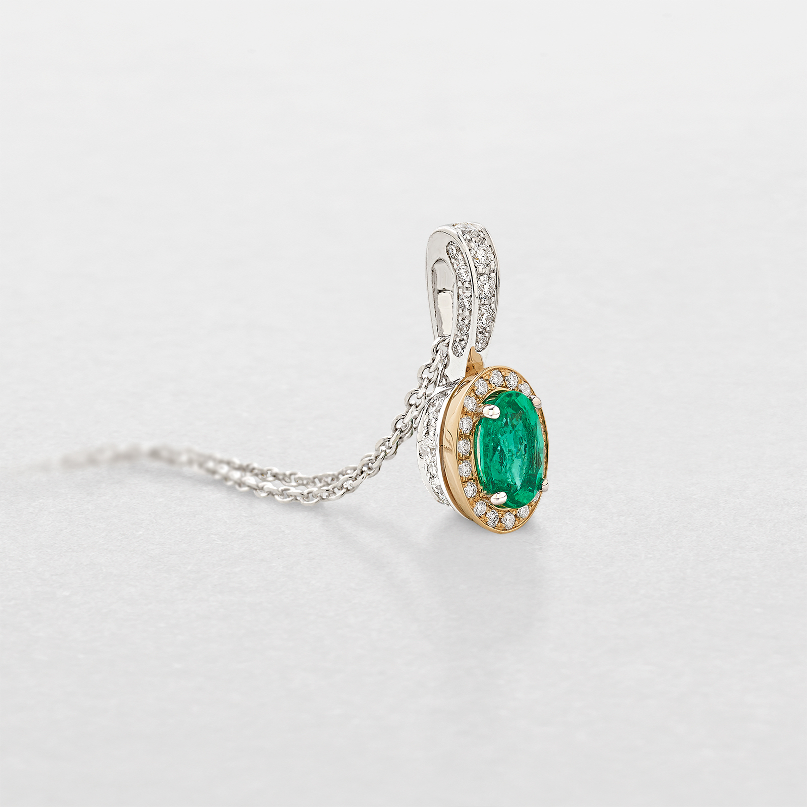 white and pink gold with diamonds and emerald necklace