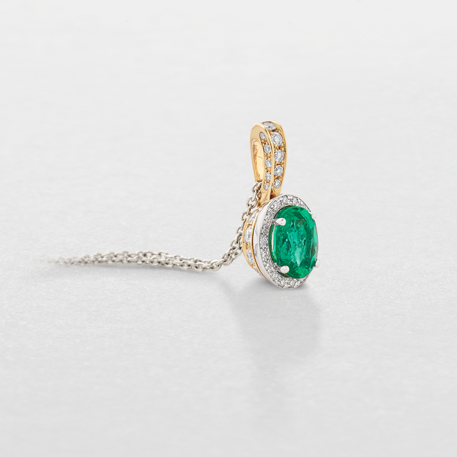 white and pink gold with diamonds and emerald necklace