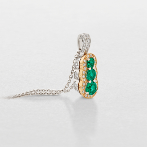 white and pink gold with diamonds and emeralds necklace