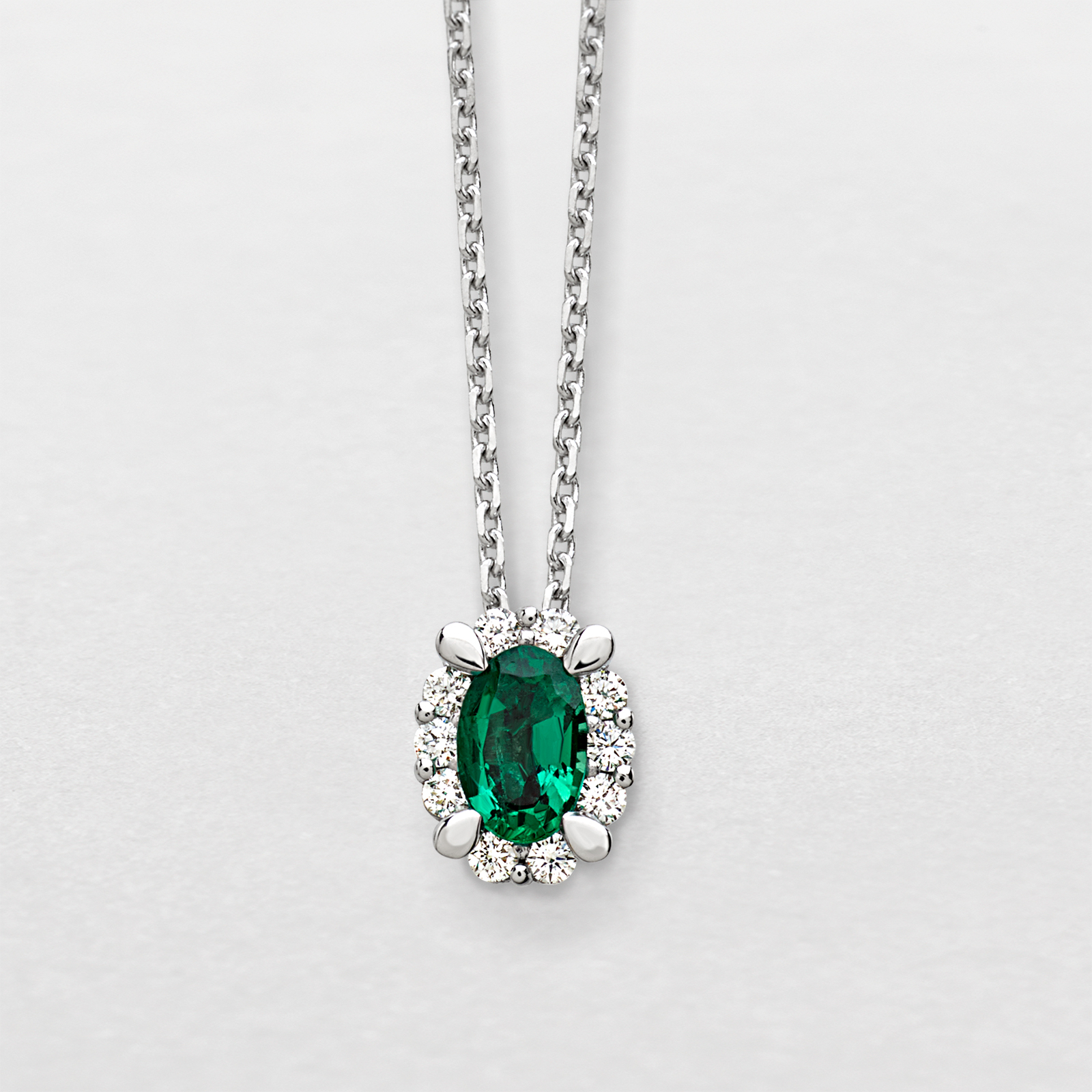 white gold with diamonds and emerald necklace
