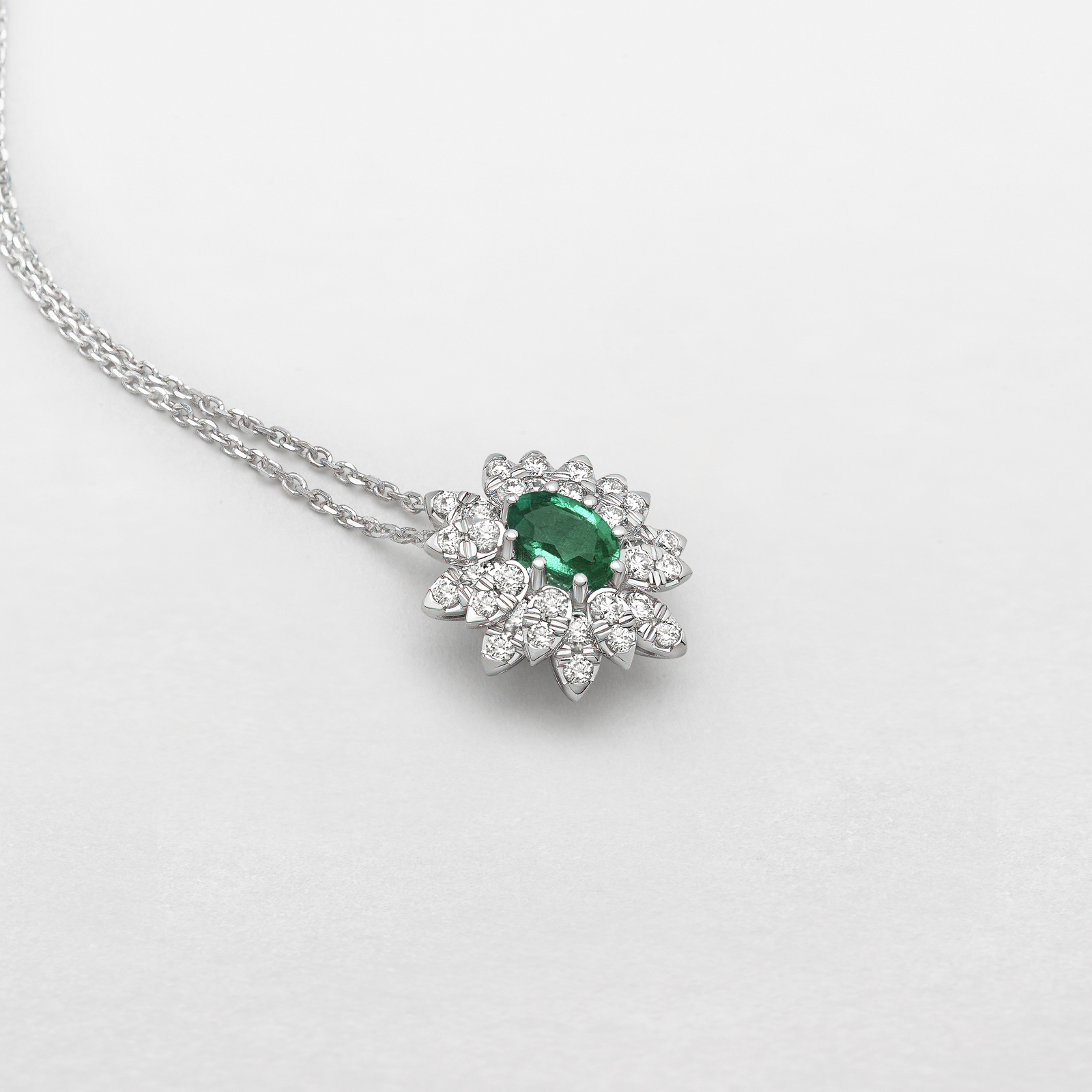 white gold with diamonds and emerald necklace