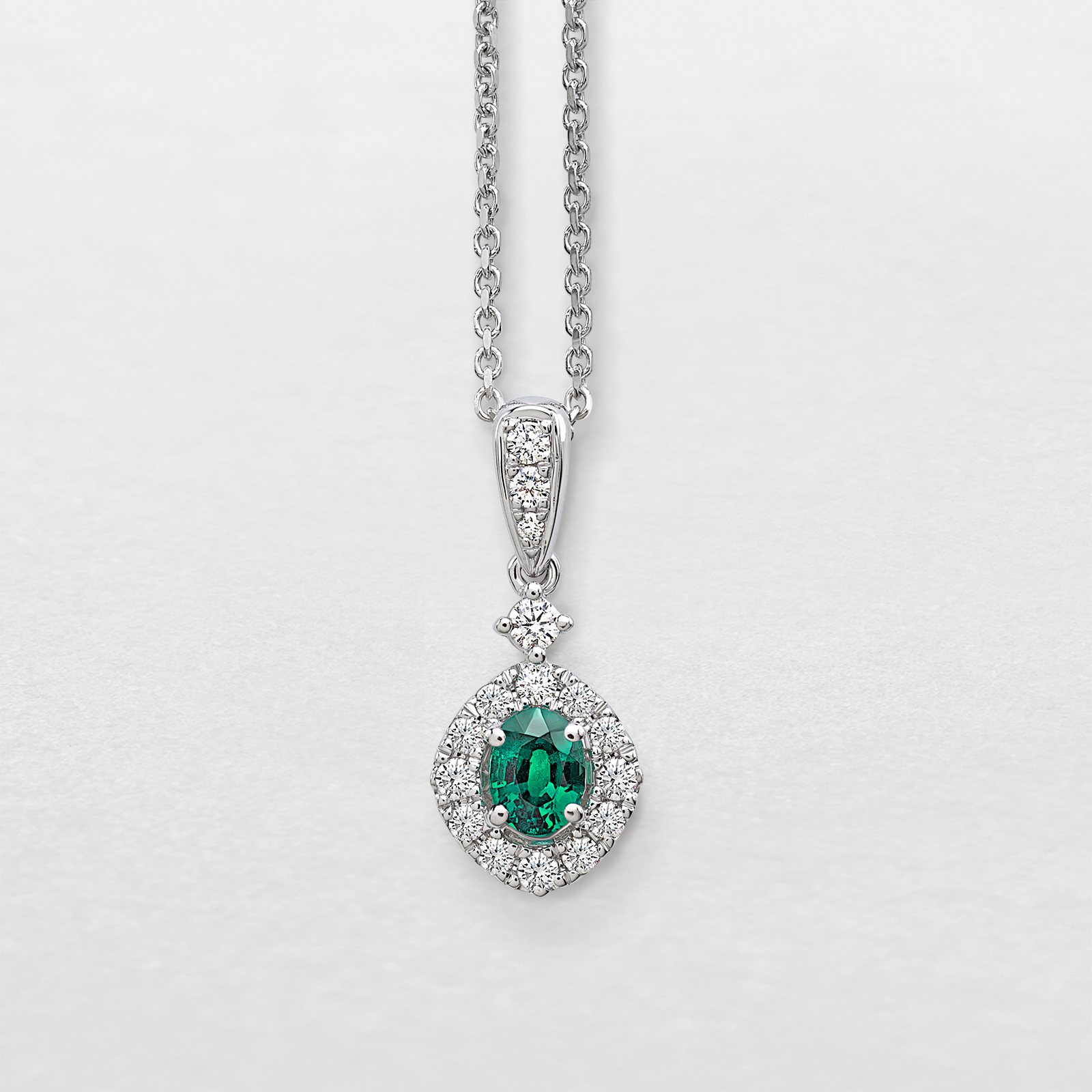 white gold with diamonds and emerald necklace