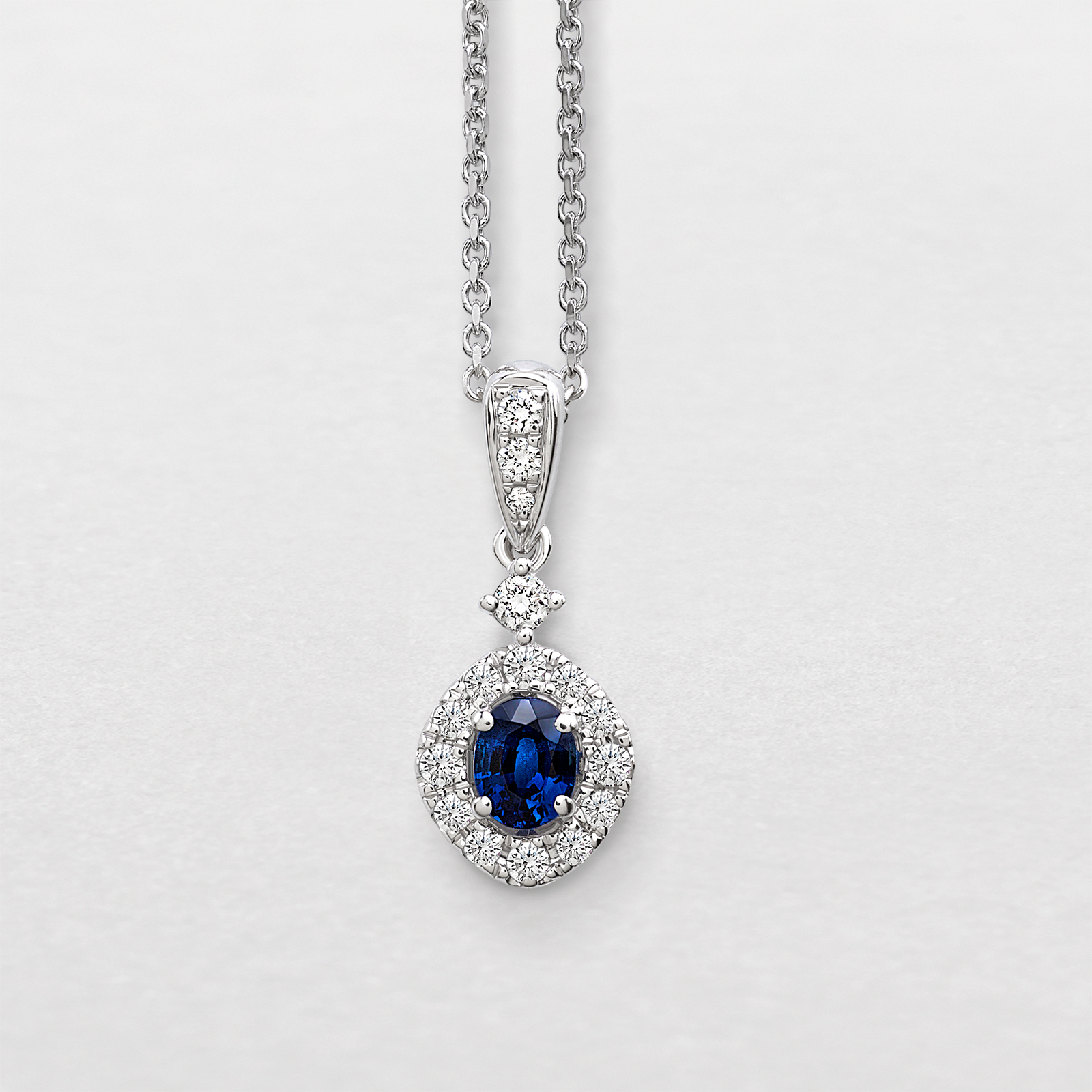 white gold with diamonds and sapphire necklace