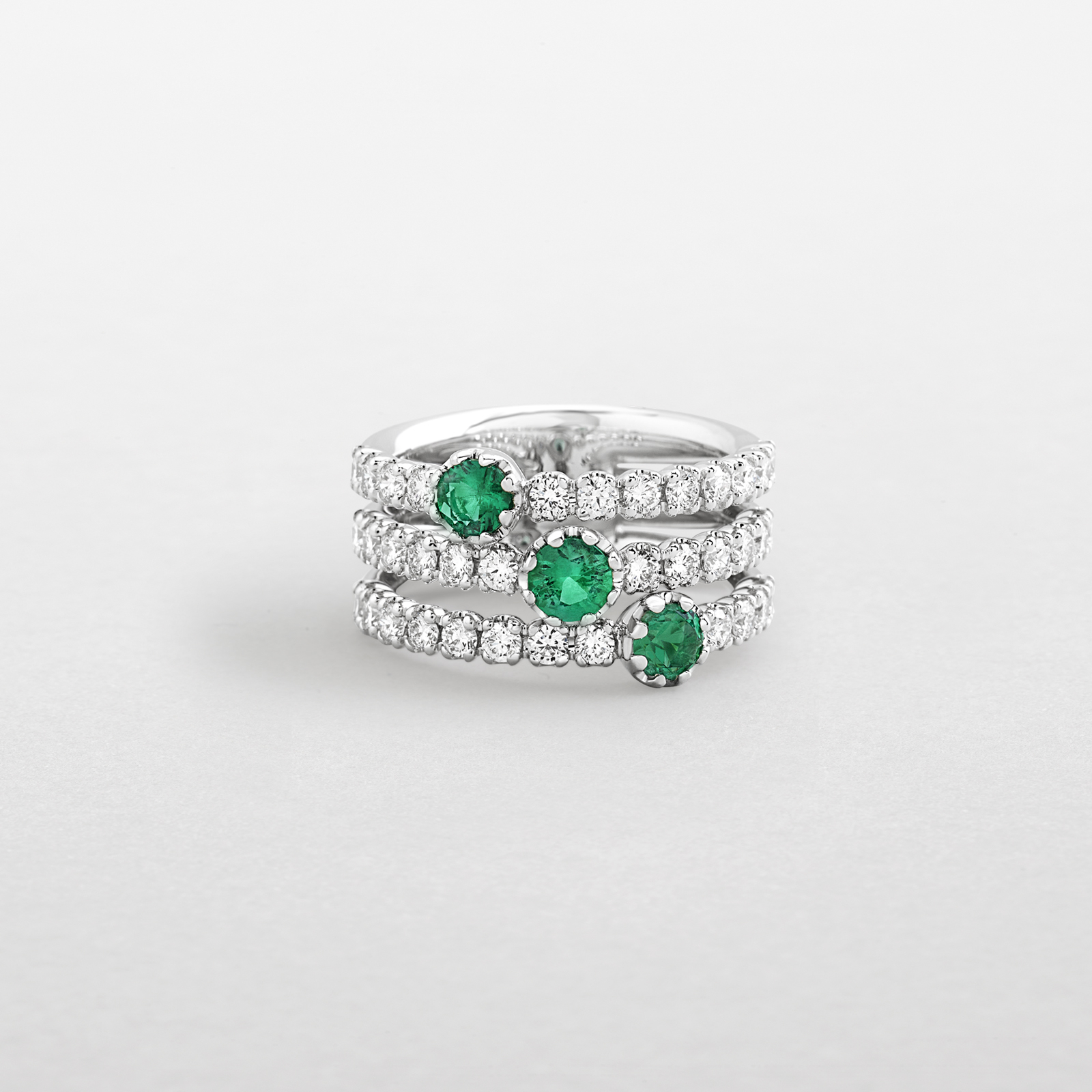 white gold with diamonds and emeralds ring