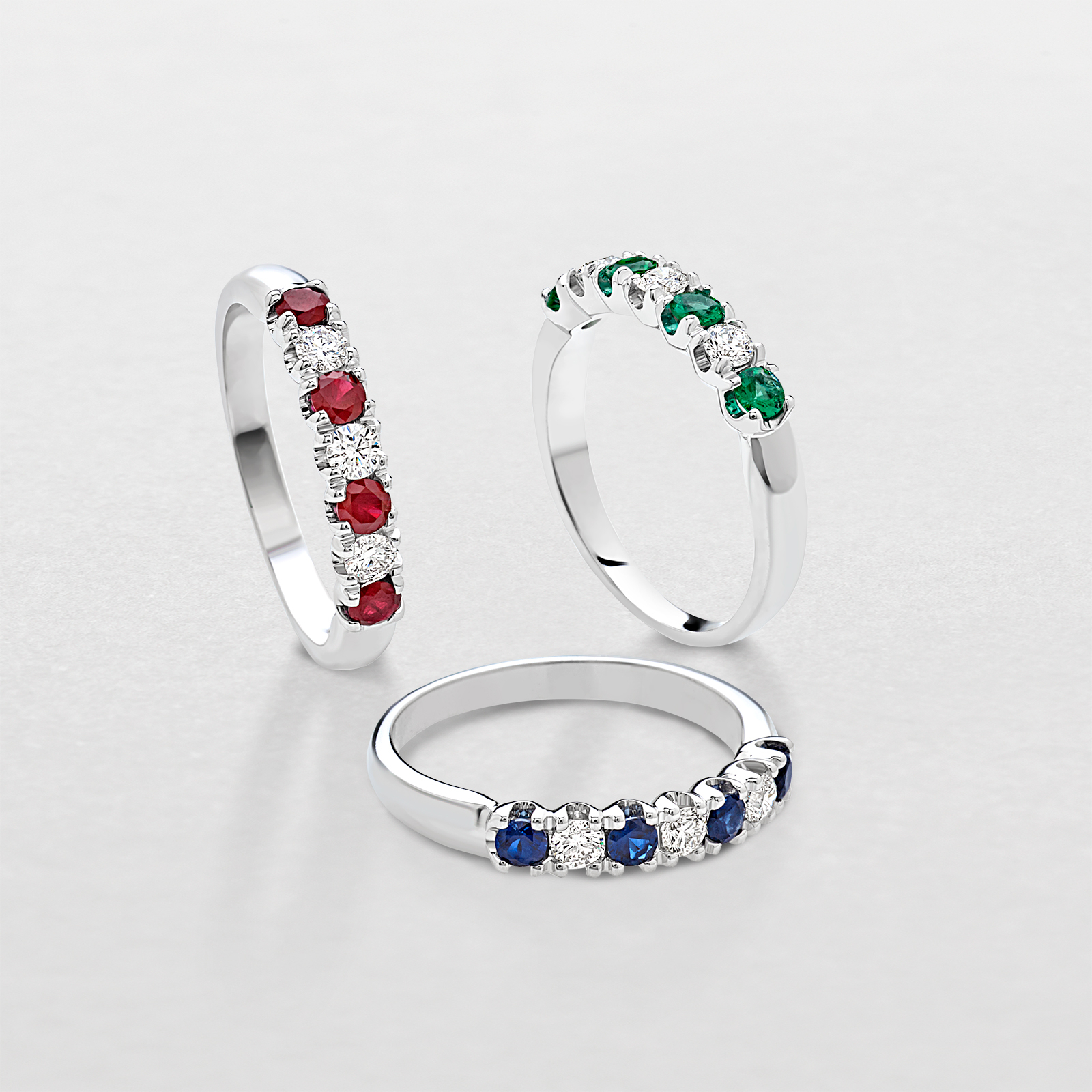 white gold with diamonds and precious color stones ring