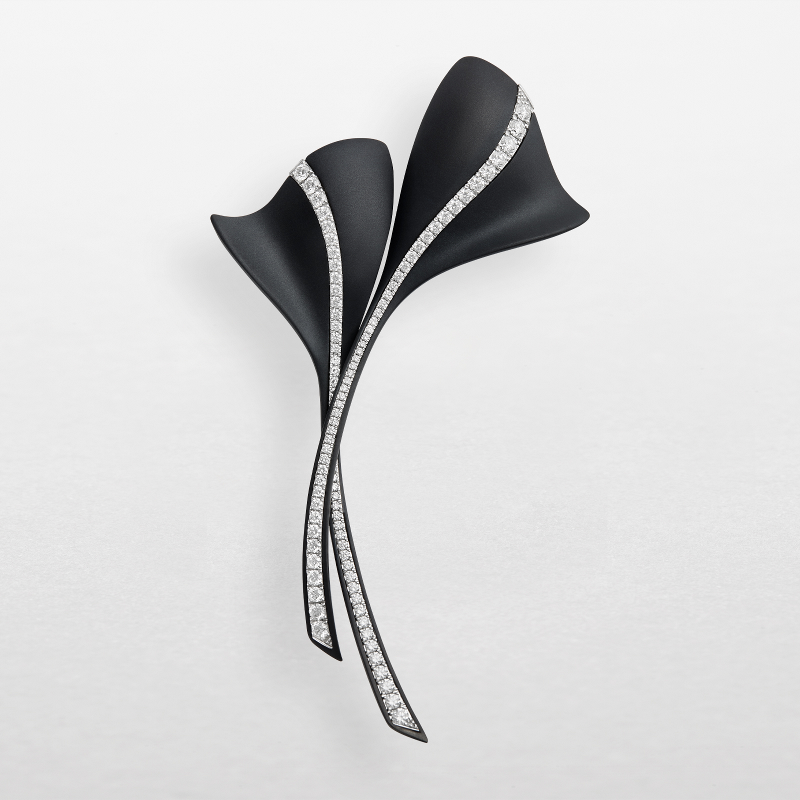 Brooch in black titanium, white gold and diamonds