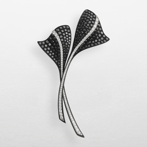 Brooch in black titanium, white gold and diamonds