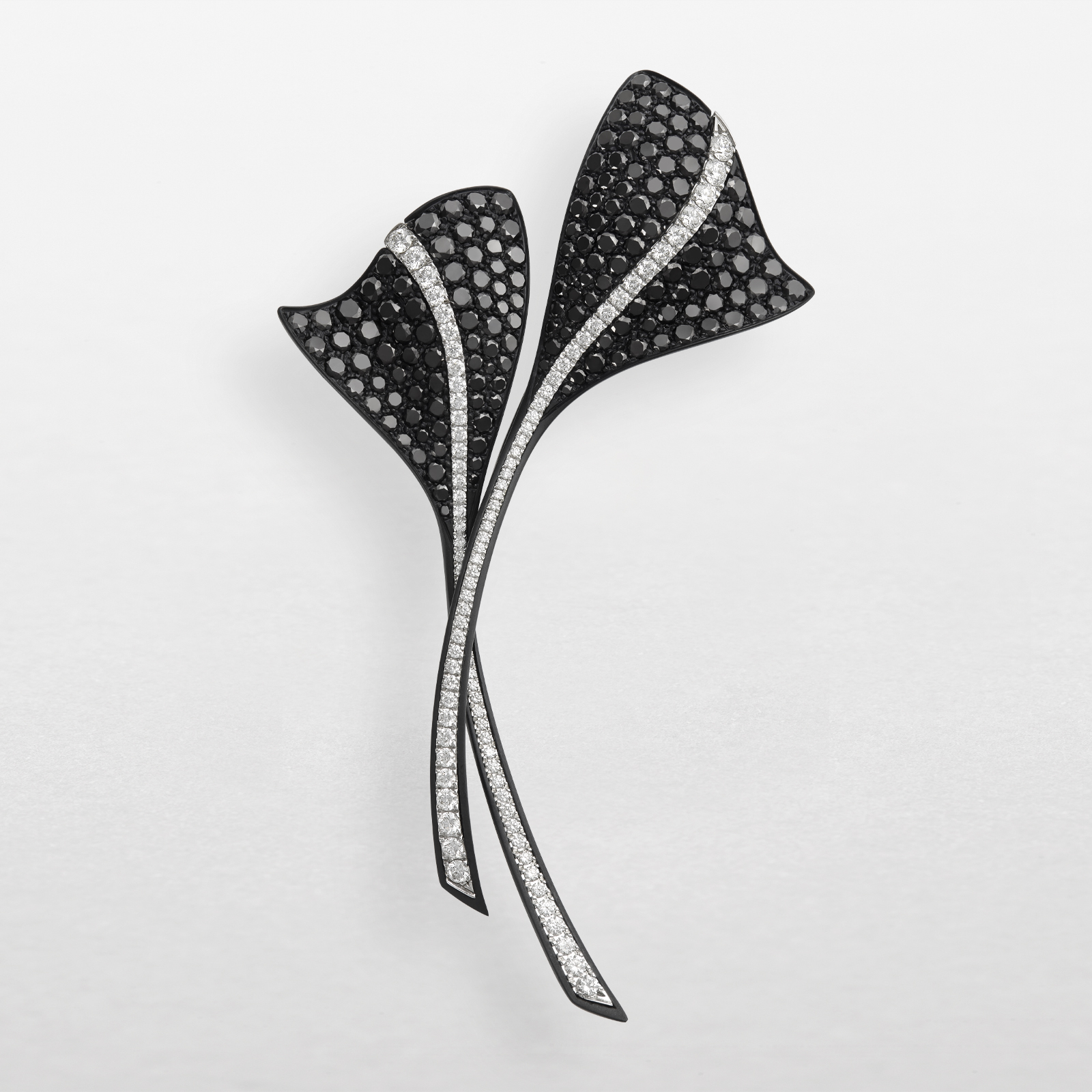 Brooch in black titanium, white gold and diamonds