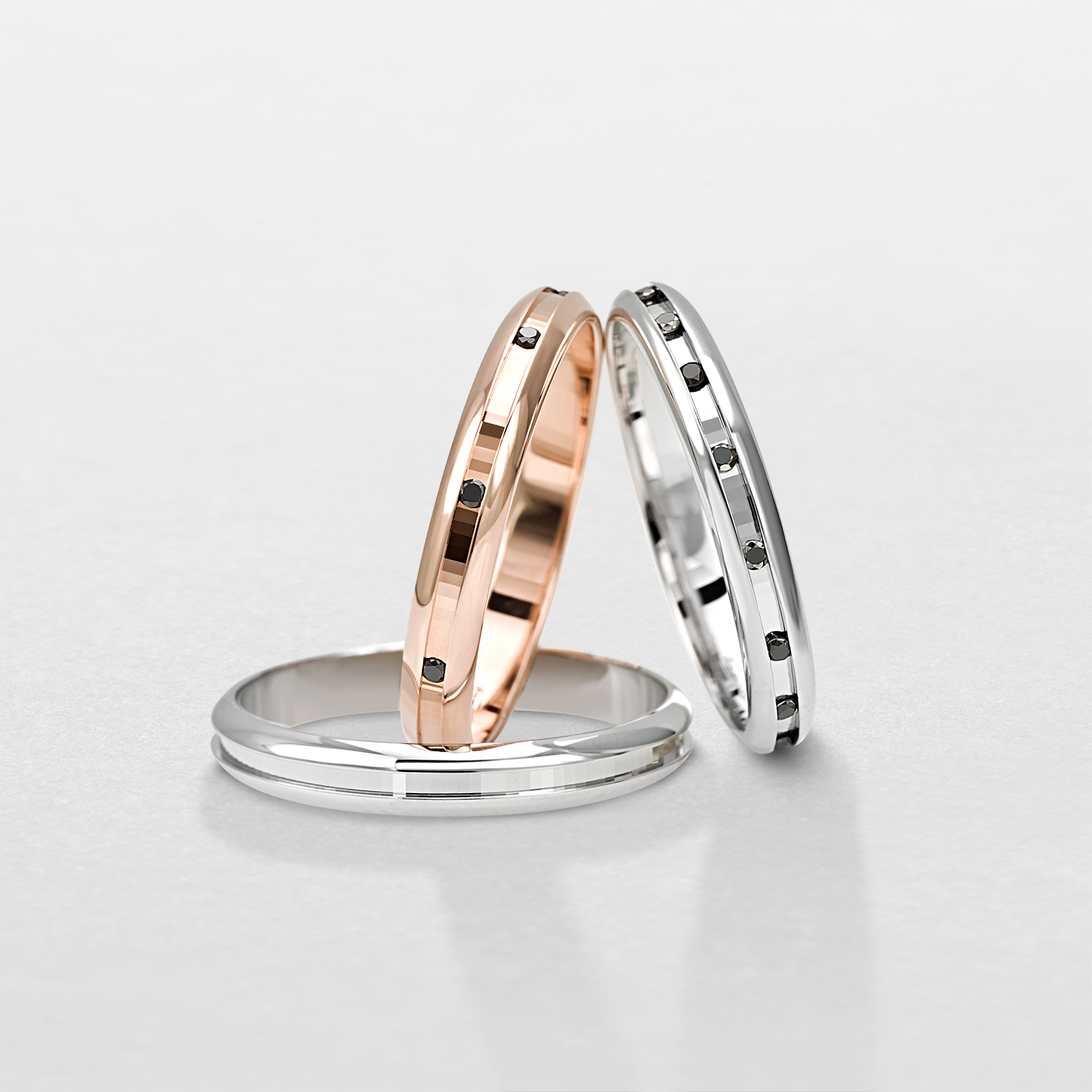 Fede nuziale da uomo e da donna in oro bianco, oro rosa e diamanti neri